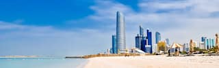 corniche beach with abu dhabi skyline