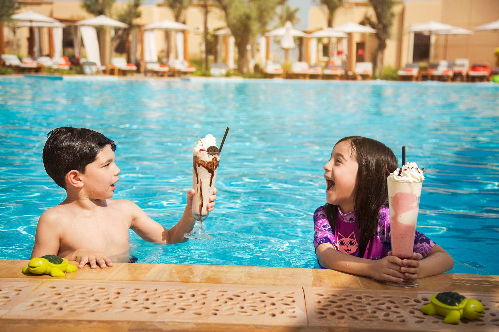 kids enjoying in saadiyat rotana resort villa pool