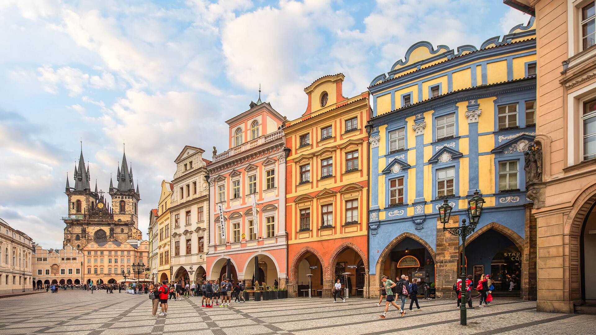 At the historic Town Hall and Church of Our Lady before Týn in old town square of Prague, Czech Republic