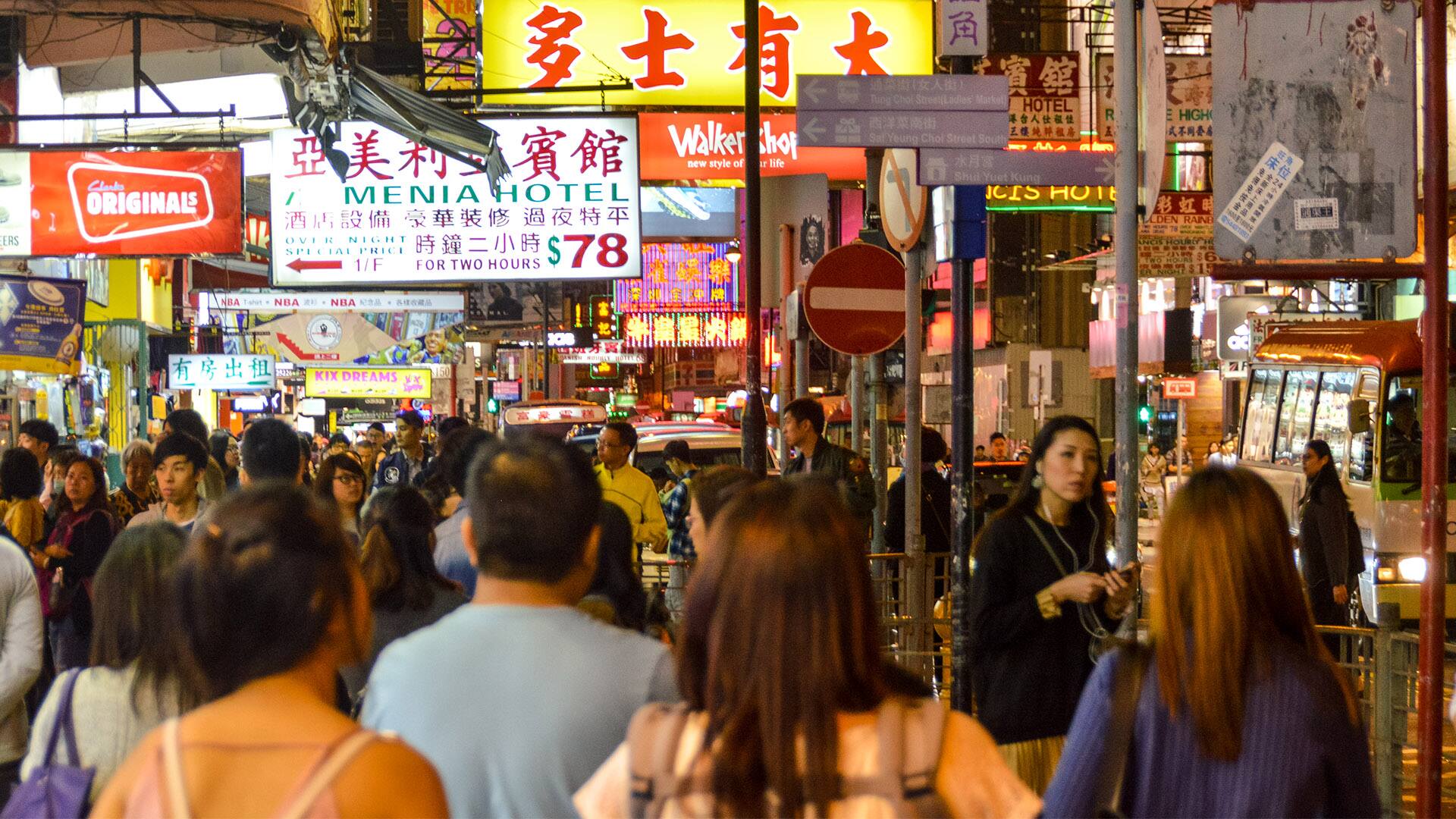 Hong Kong street scene with neon signs at night