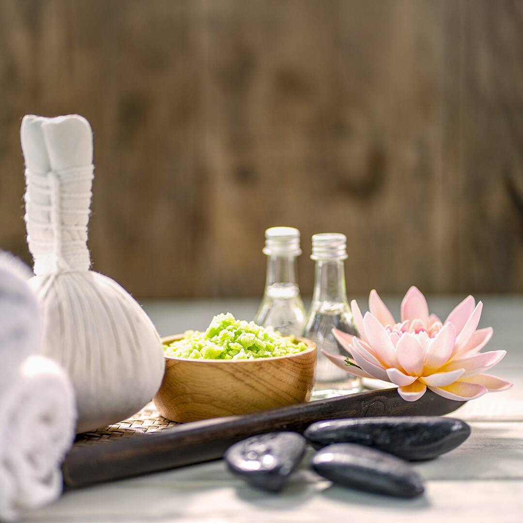 Beautiful composition of spa treatment on wooden table