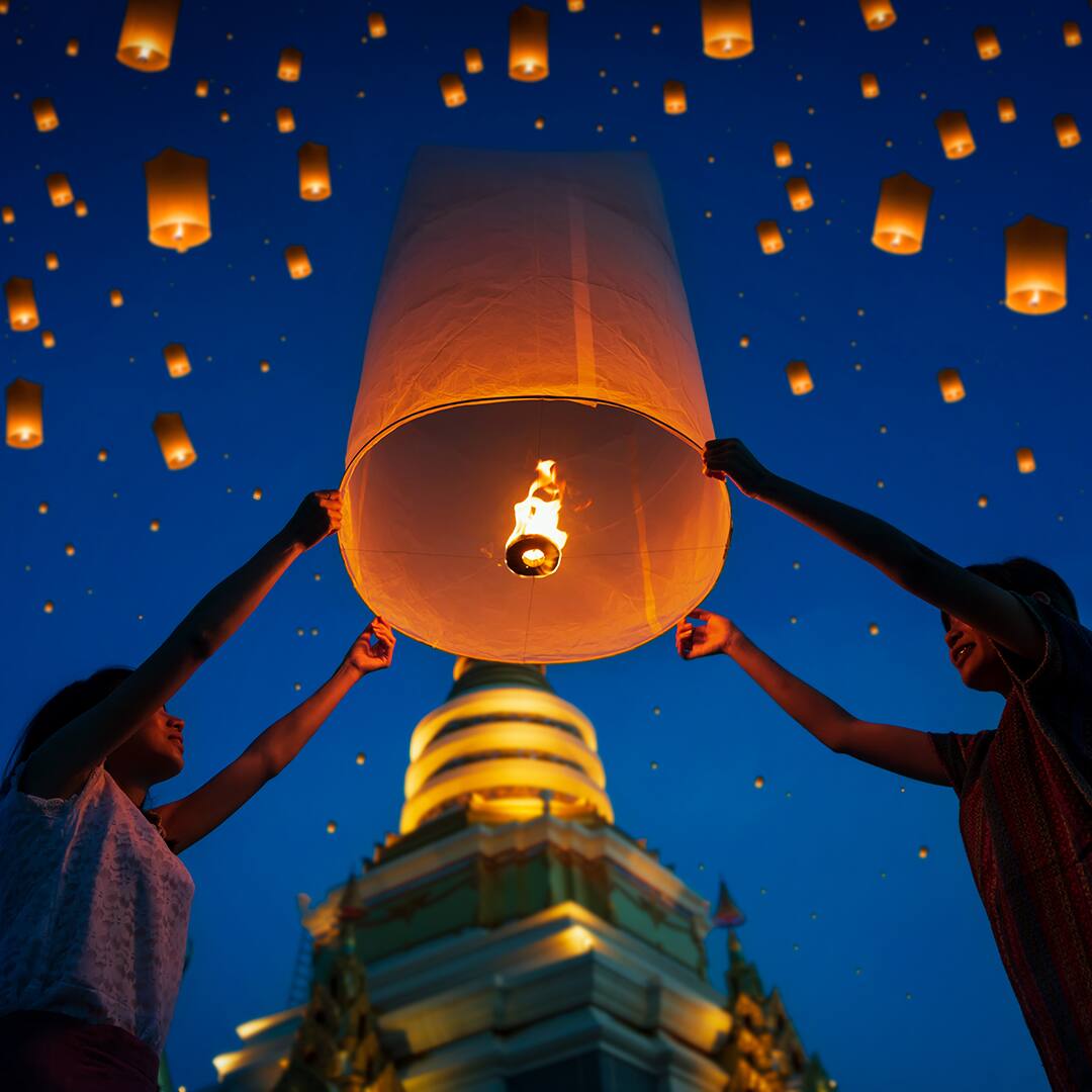 People floating lamp in Yi Peng festival at Chiangmai Thailand