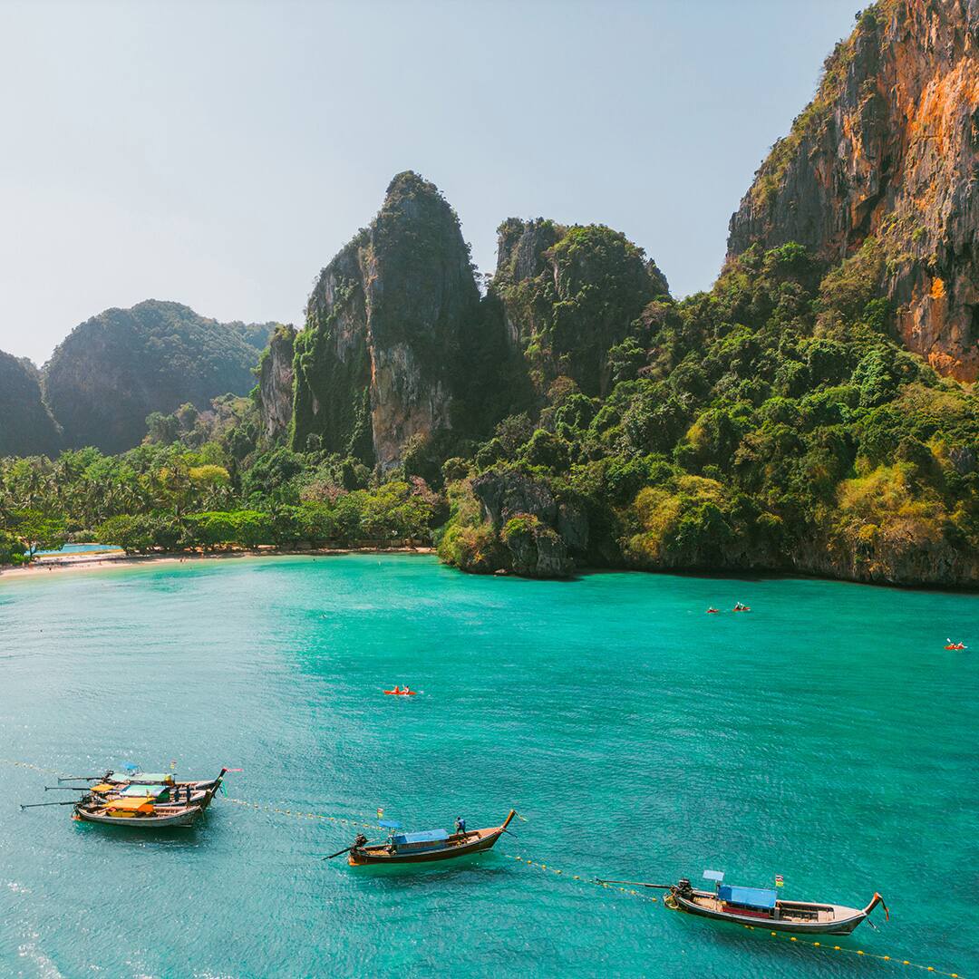 Aerial view of sea kayaking near idyllic beach