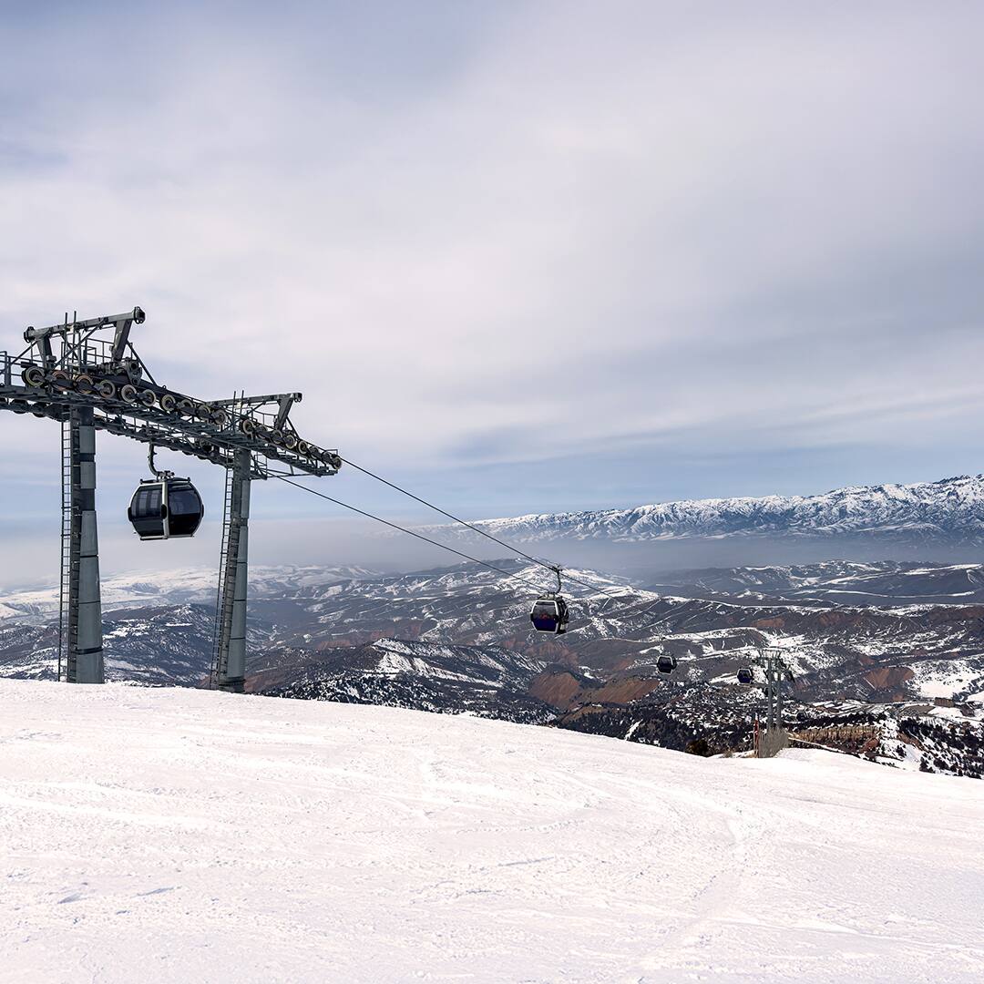 Gondola lift cabins at Amirsoy ski resort, Uzbekistan