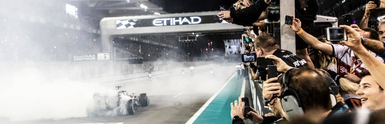 racing cars approaching the finish line in yas Marina circuit