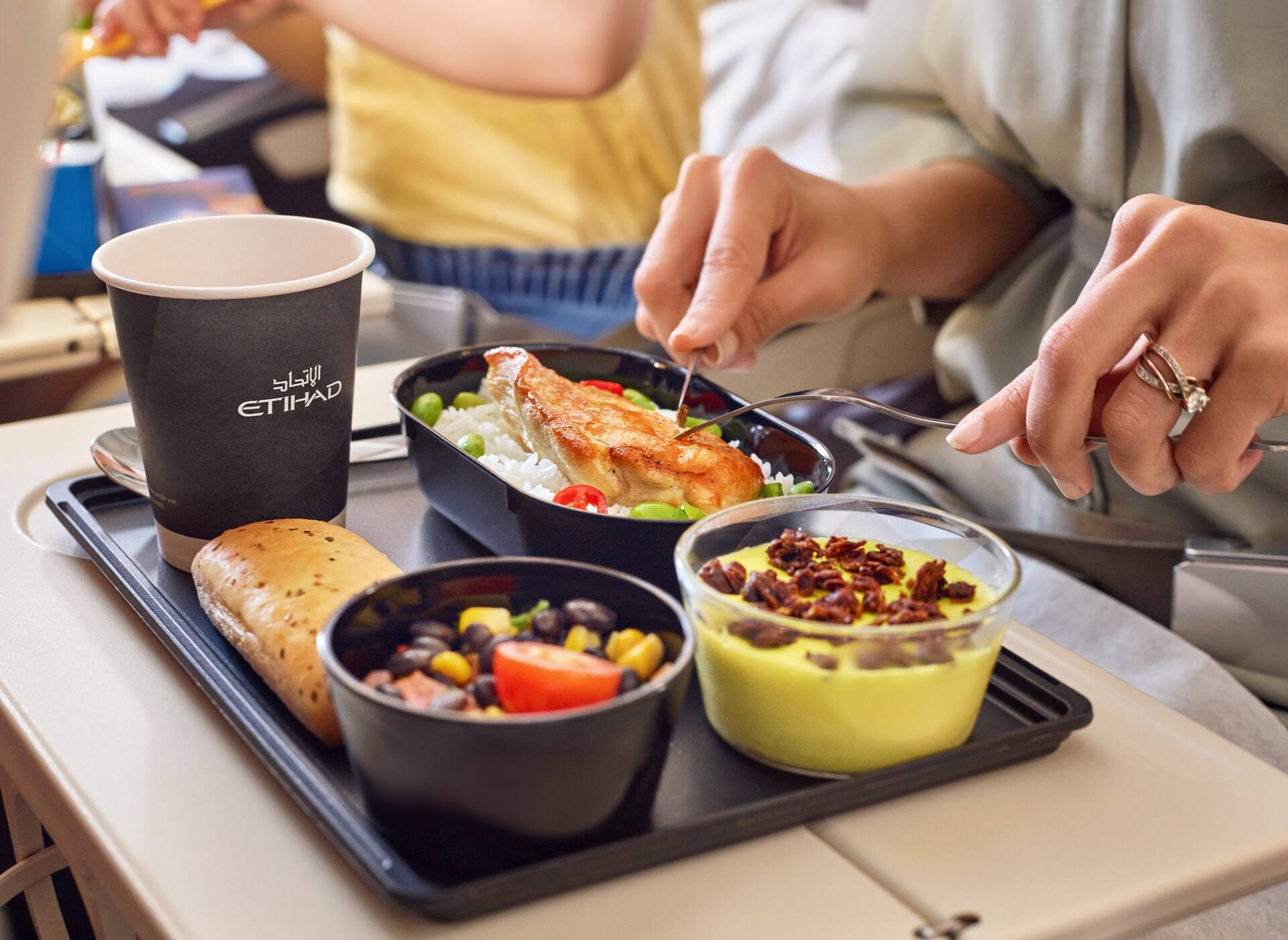 A380 Economy guest eating meal