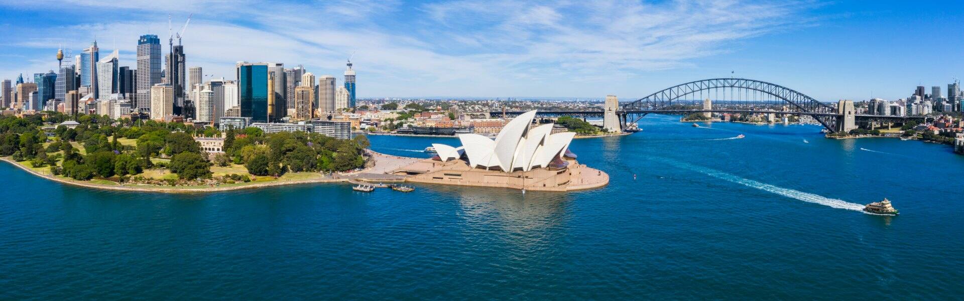 view of sydney harbour australia showing the opera house and bridge on a sunny day