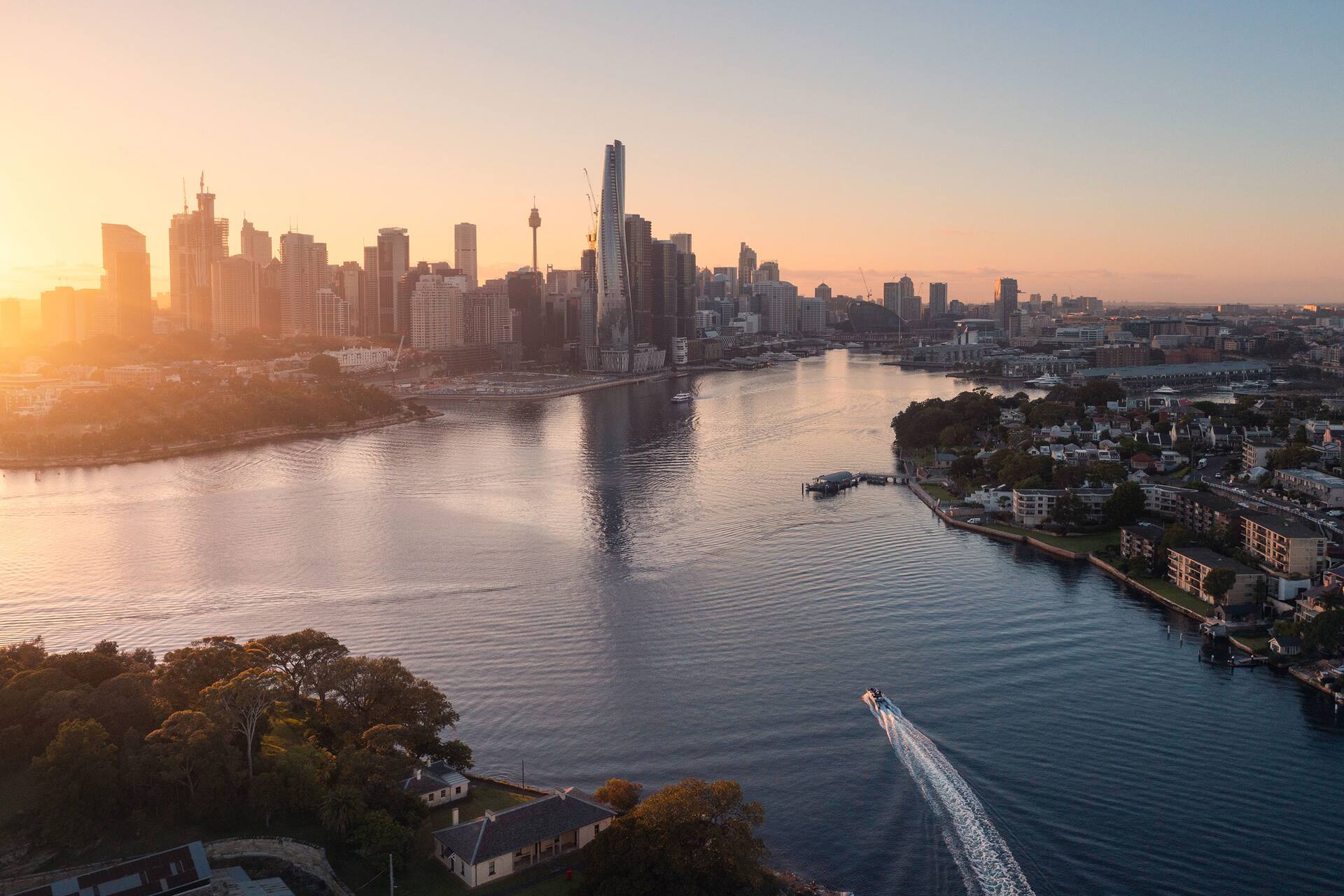 view of cockle bay side of darling harbour at night with rows of boats in Sydney 