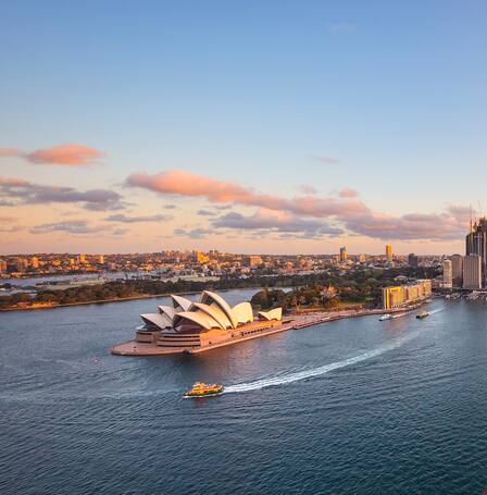view of the sydney harbour bridge at sunset 