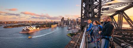 view of the sydney harbour bridge at sunset 