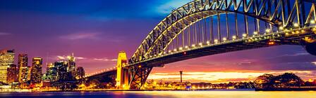 view of the sydney harbour bridge at sunset 