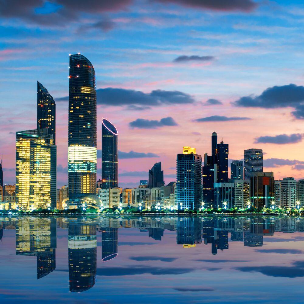 view of abu dhabi skyline at sunset