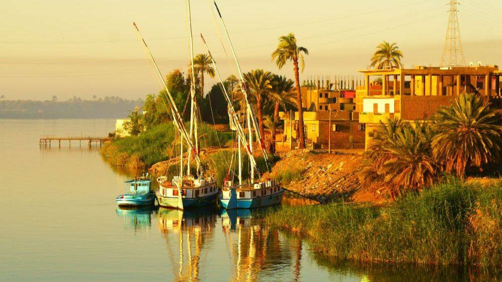sailing boats on river nile at dusk in egypt 