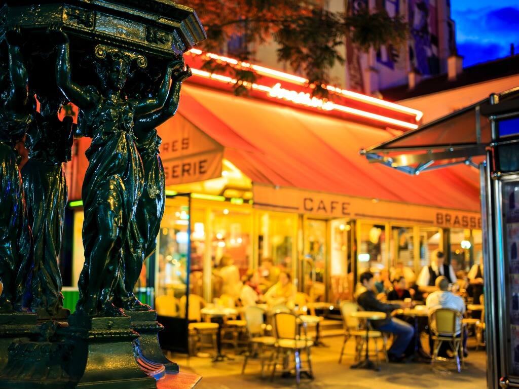 diner sit outside a cafe in paris at night