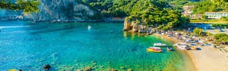 boats on ocean in harbor in greece