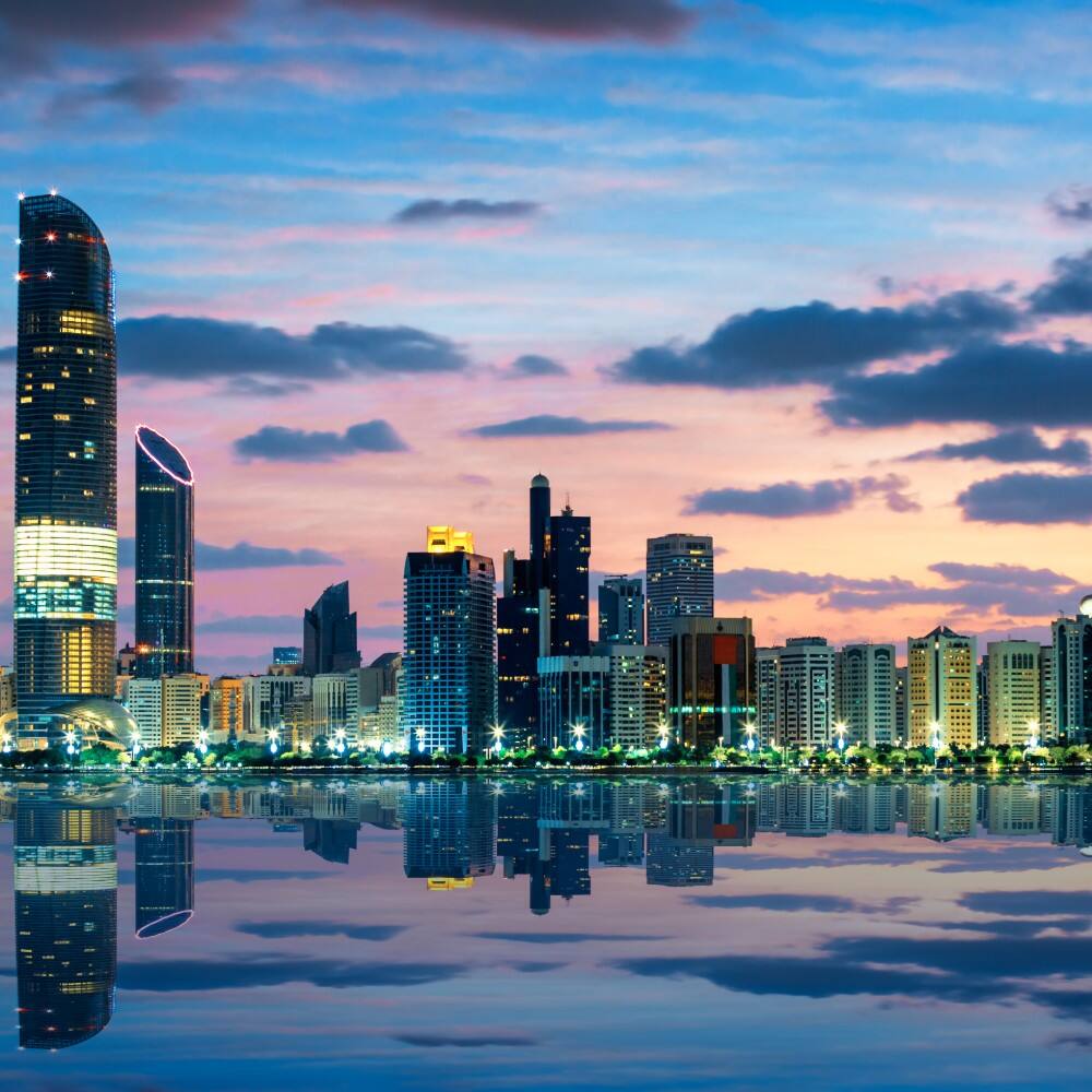 view of abu dhabi skyline at sunset 