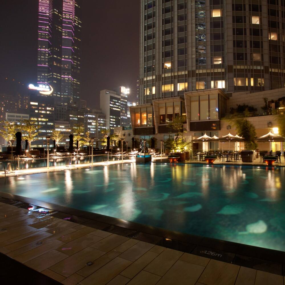 the pool at a hong kong hotel at night