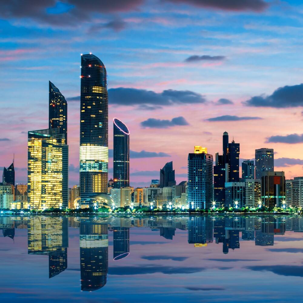 view of abu dhabi skyline at sunset 