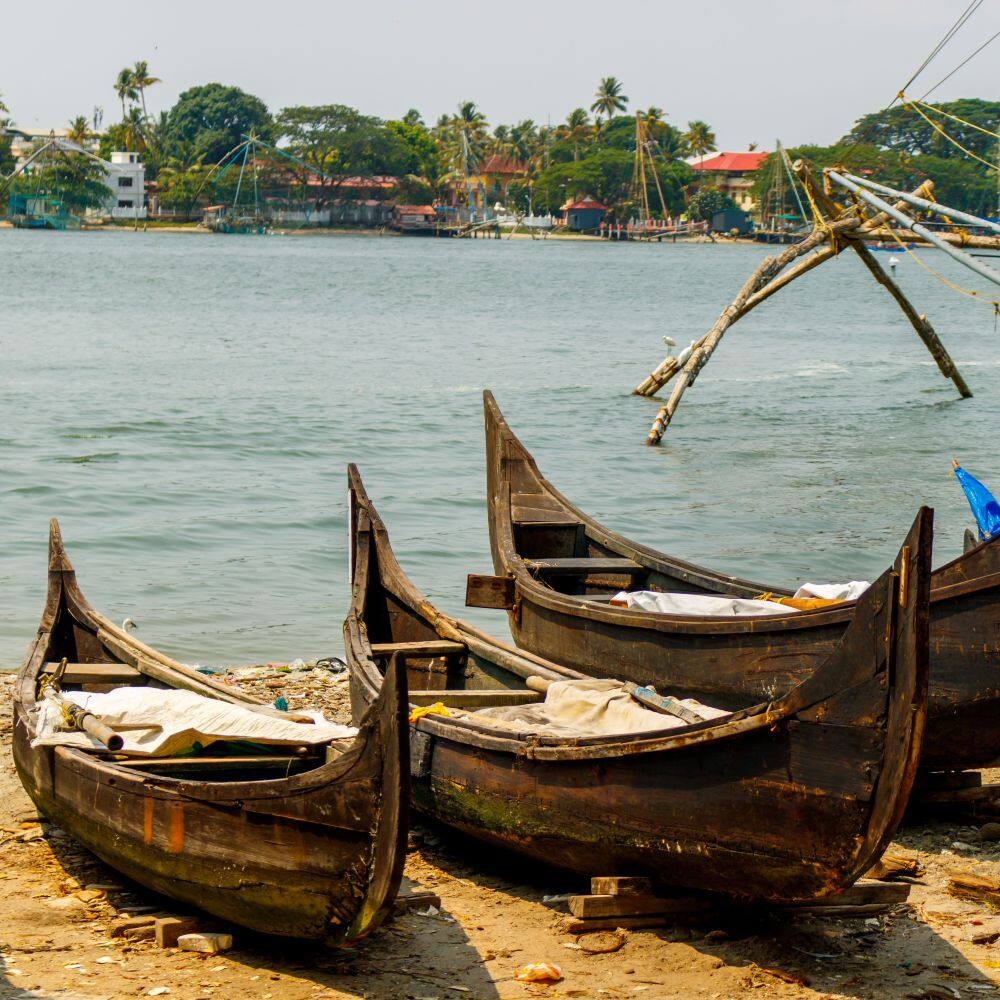 boats on a beach in kochi