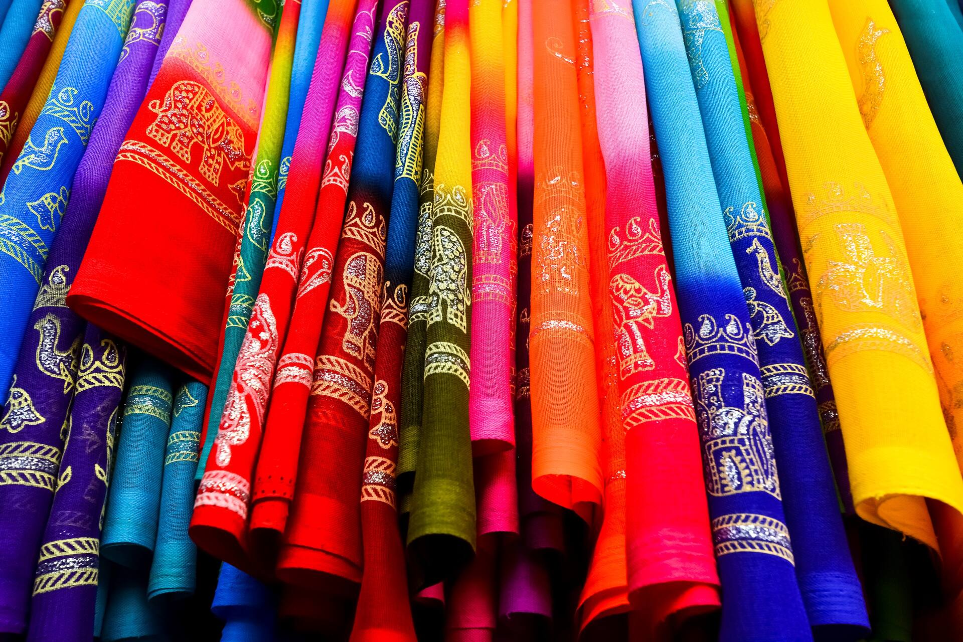 colourful sari clothes and textile at market in india