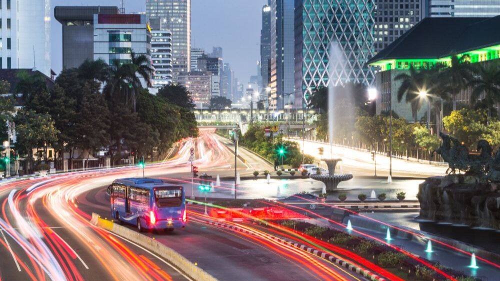 jakarta at night with bus and roads visible