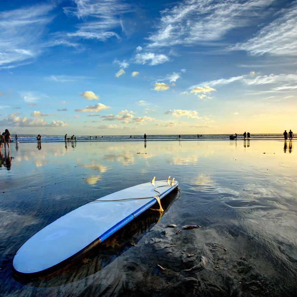 sunset surfing on kuta beach in bali