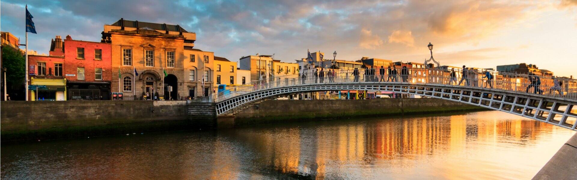 the hapenny bridge in dublin ireland at sunset
