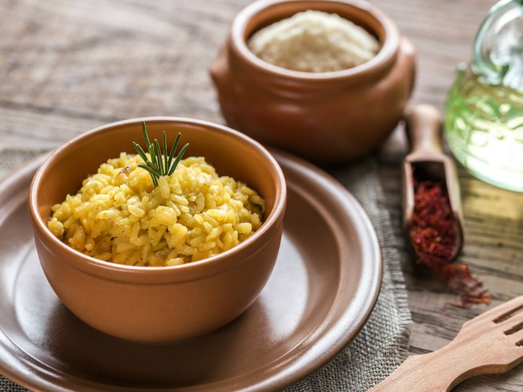 a bowl of risotto with saffron and parmesan