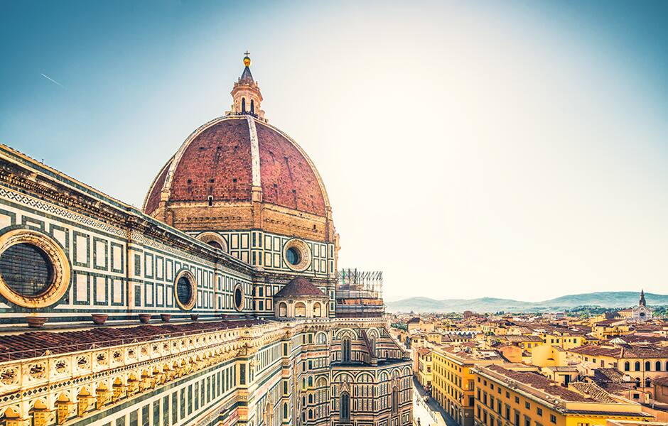view of the dome of cathedral of florence and clear skies in italy