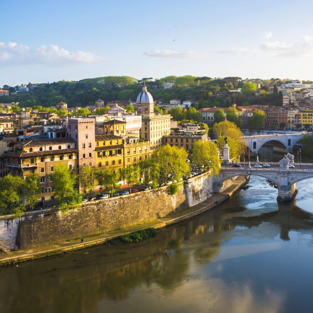 tiber river bridge and city rome 