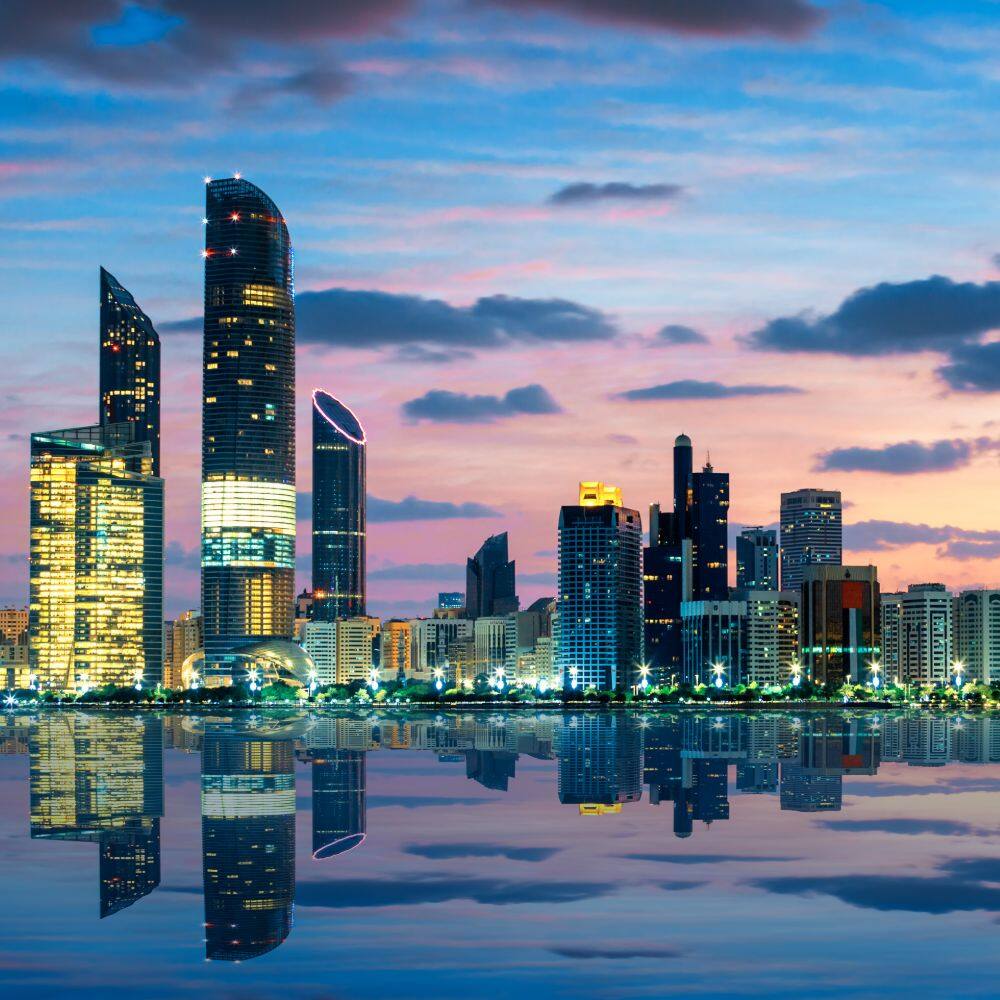 view of abu dhabi skyline in sunset