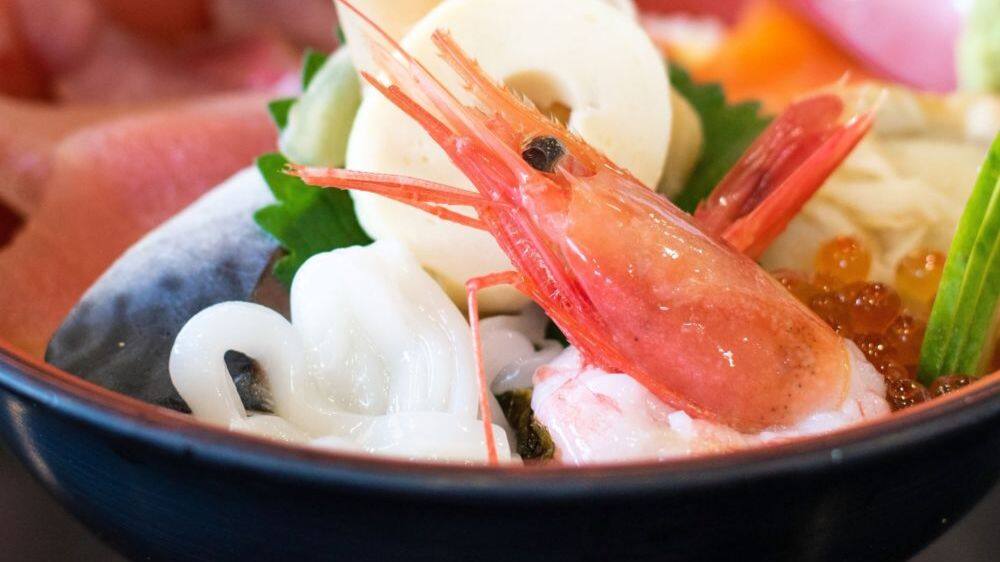 bowl of seafood with large prawn in the front tokyo japan