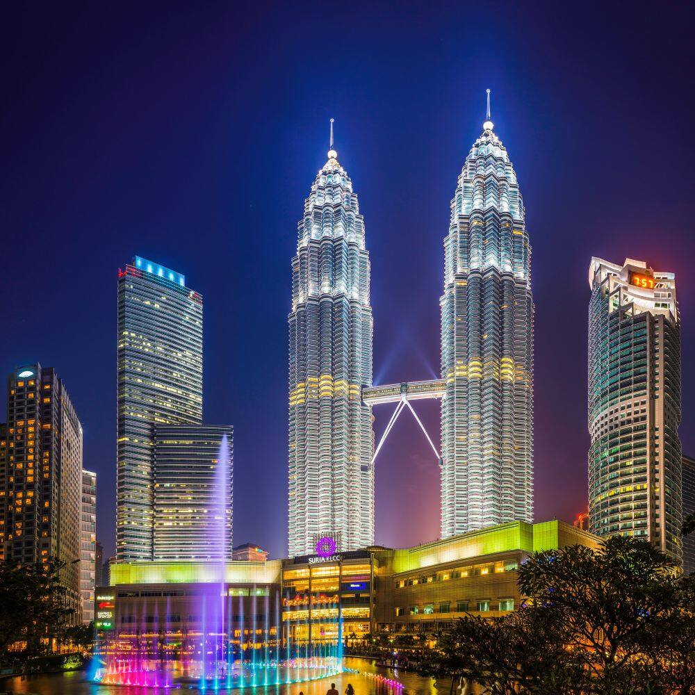 petronas towers klcc park illuminated at night kuala lumpur malaysia 