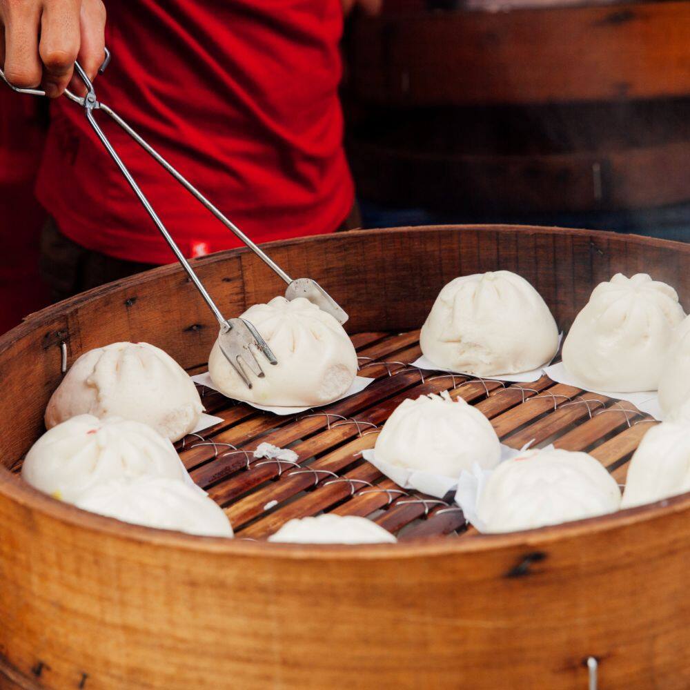 local street food of steamed buns at market stall in china town kuala lumpur 