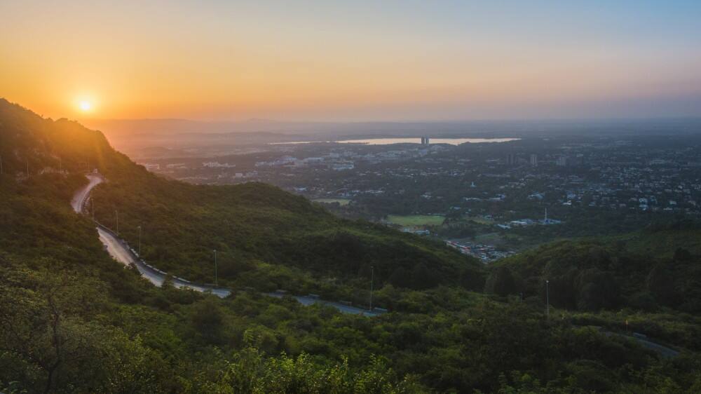 view of countryside aroura islamabad at sunset