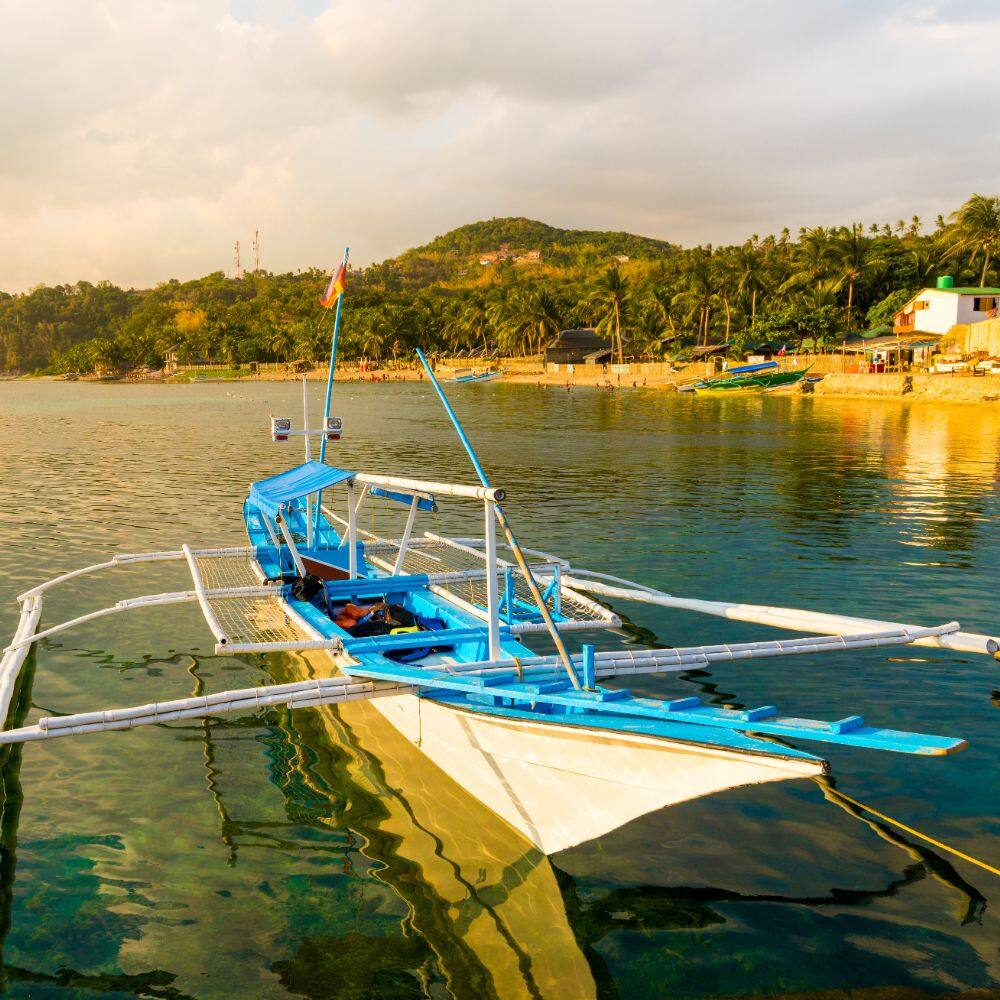 view of a fishing boat by a beach in manila