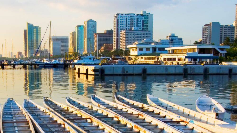 long boats lined up at manila port