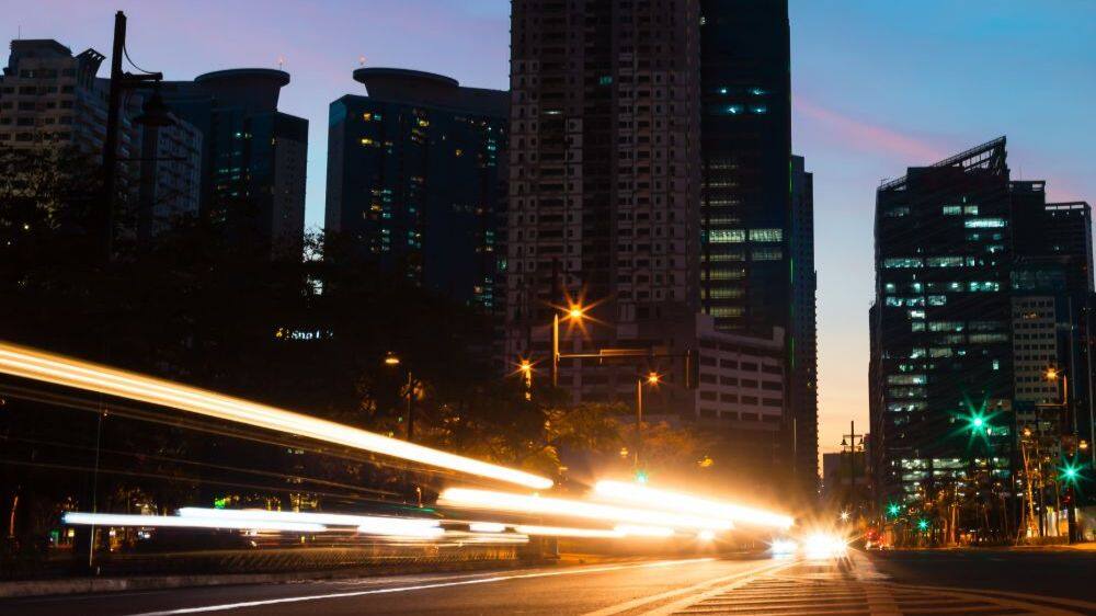 manila at night with abstract car headlights 