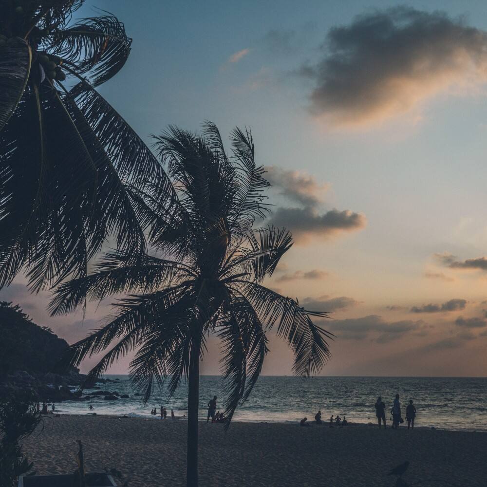 families at sunset on karon beach phuket 