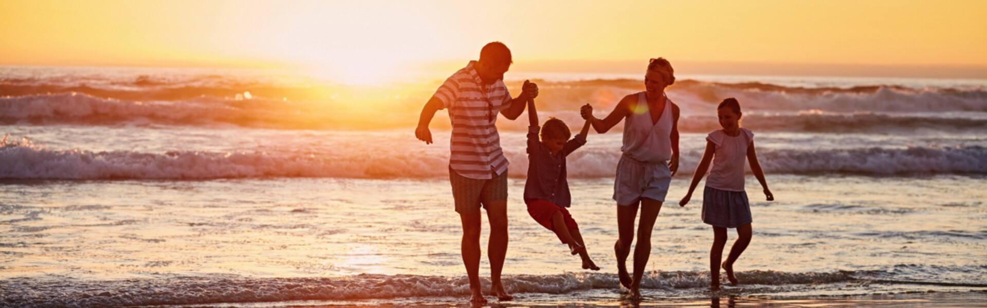 family enjoying at the beach