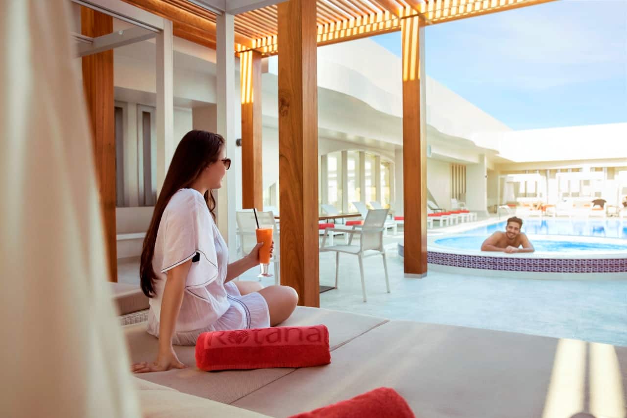 woman sitting by pool