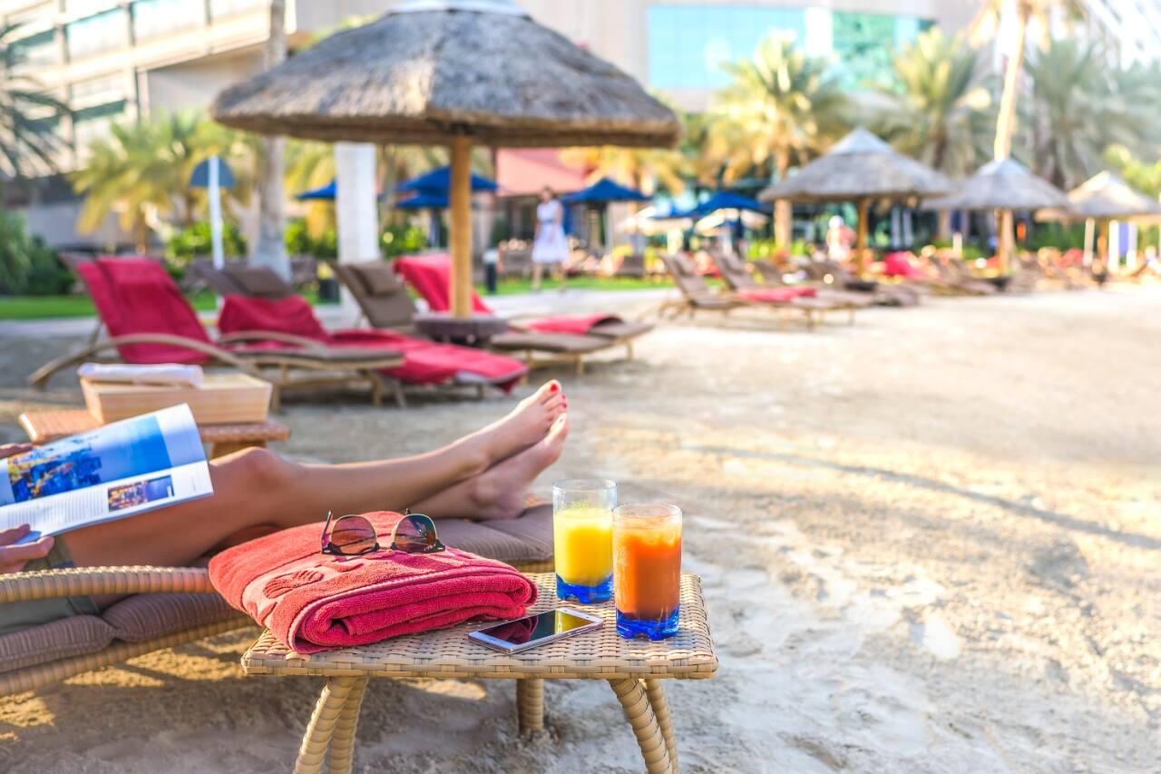 sun loungers on beach at beach rotana in abu dhabi