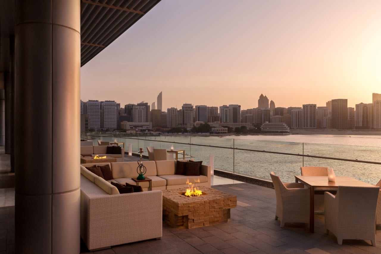 outdoor terrace at the rosewood abu dhabi overlooking the sea