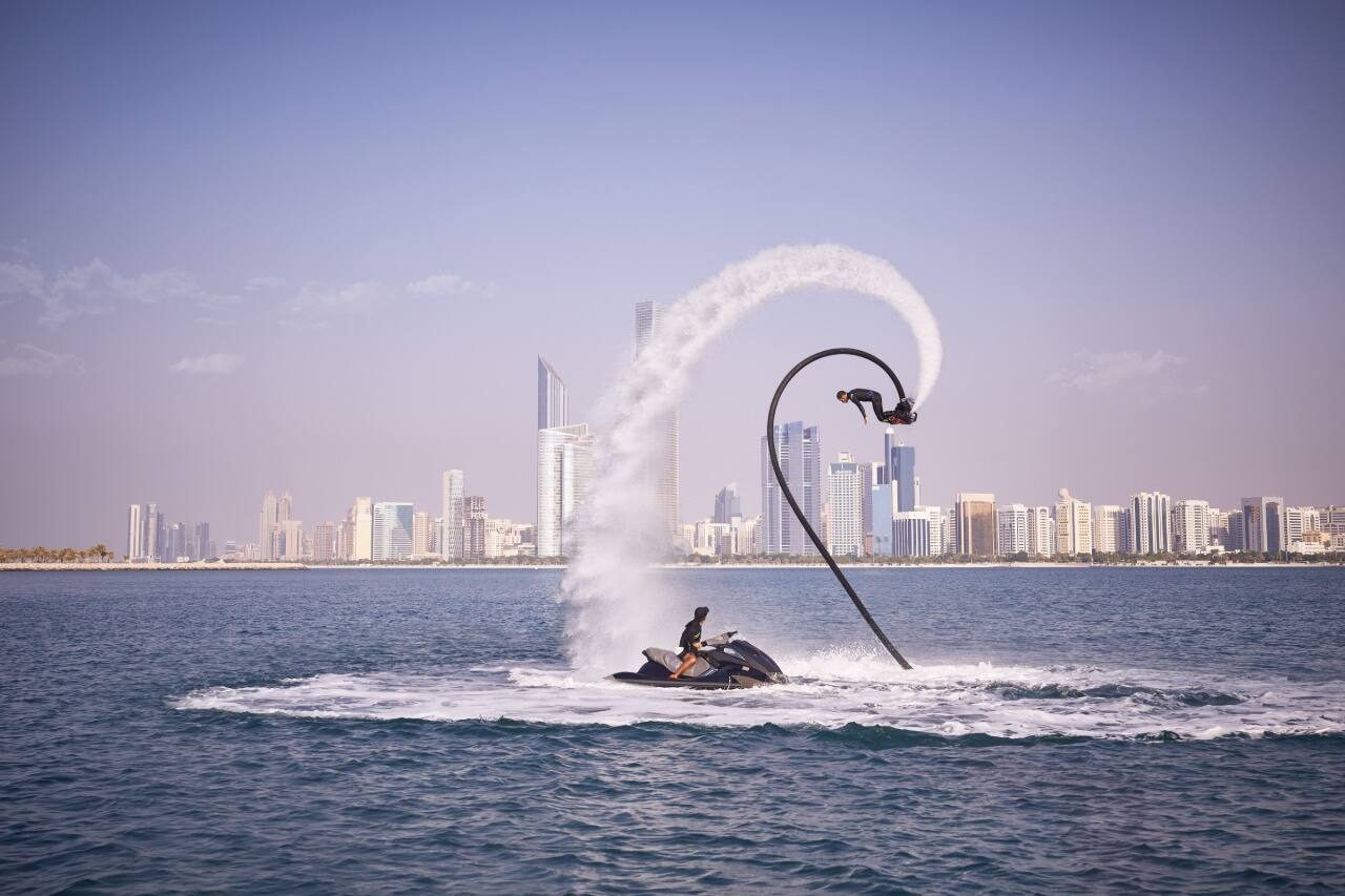 flyboarding with abu dhabi corniche in background
