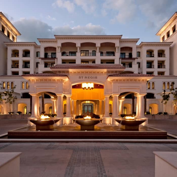 st regis exterior lit up at night