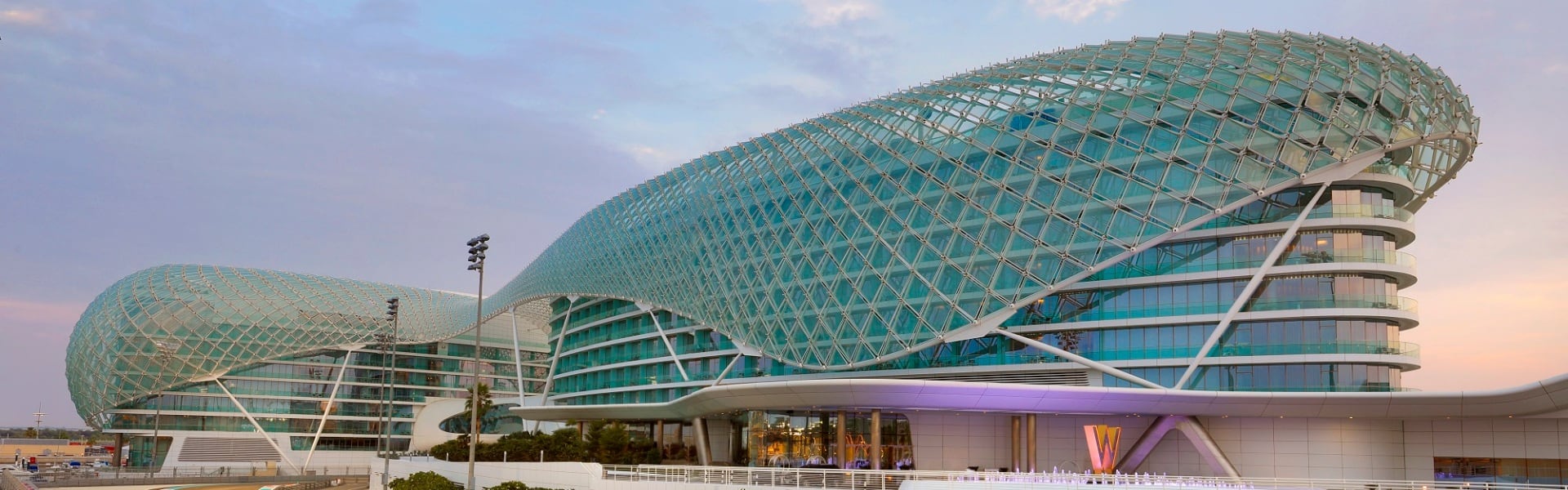w abu dhabi glass entrance at sunset
