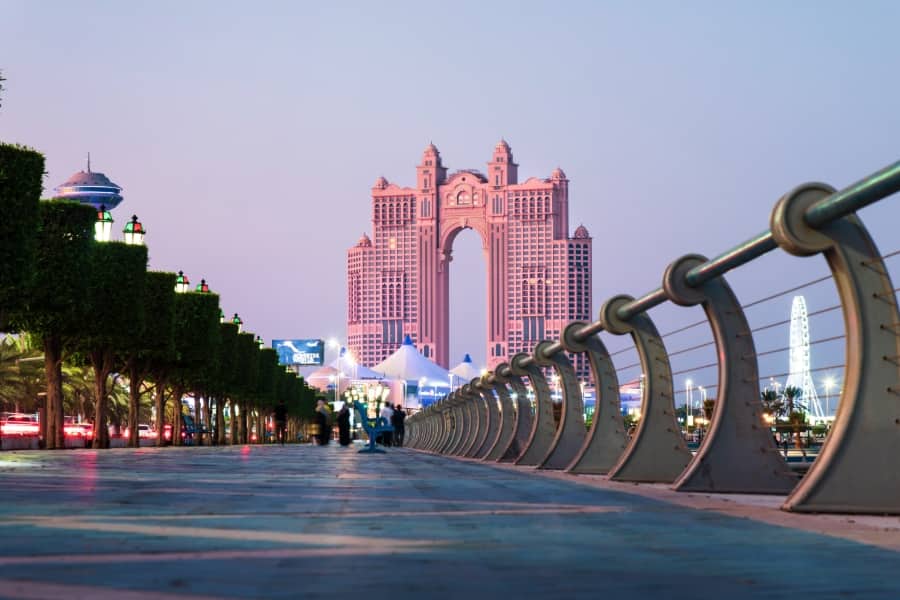view of hotel in distance looking down corniche road in abu dhabi