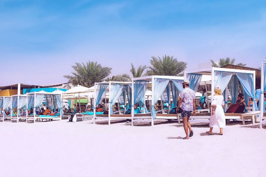 couple walking on yas beach