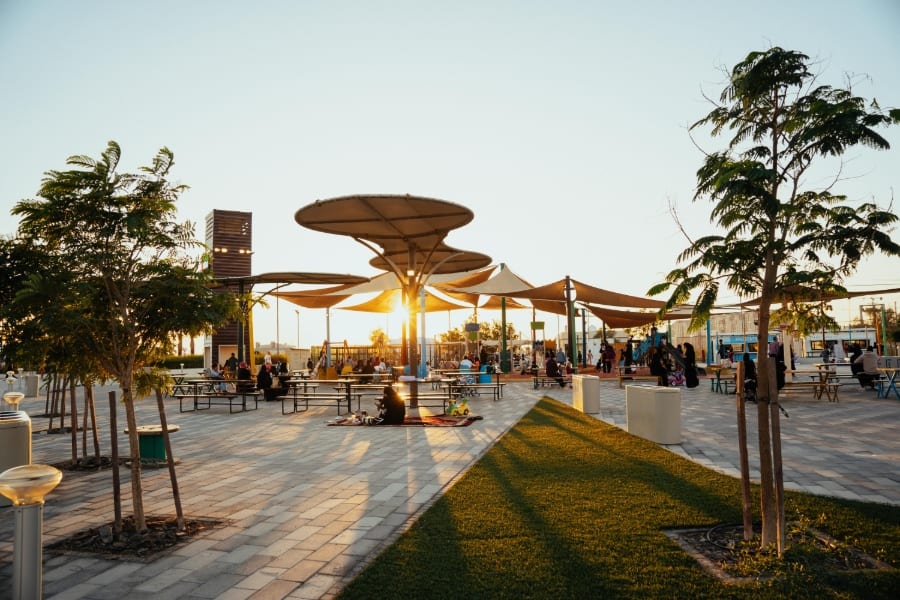 outdoor dining in masdar city abu dhabi at sunset