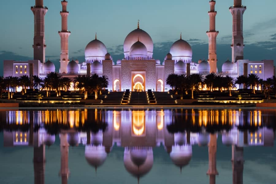 sheikh zayed grand mosque illuminated at night 
